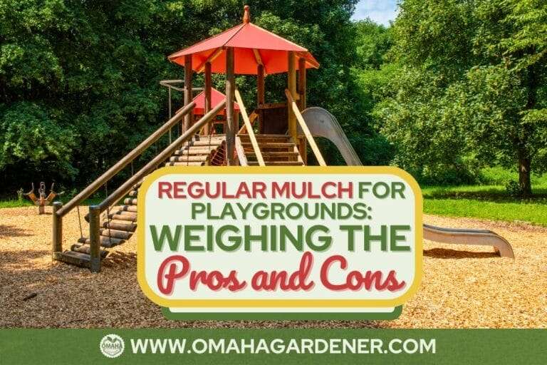 A playground with wooden structures and slides surrounded by mulched ground. A sign in front reads "Can You Use Regular Mulch for Your Playground? Weighing the Pros and Cons." Website: www.omahagardener.com. omahagardener.com