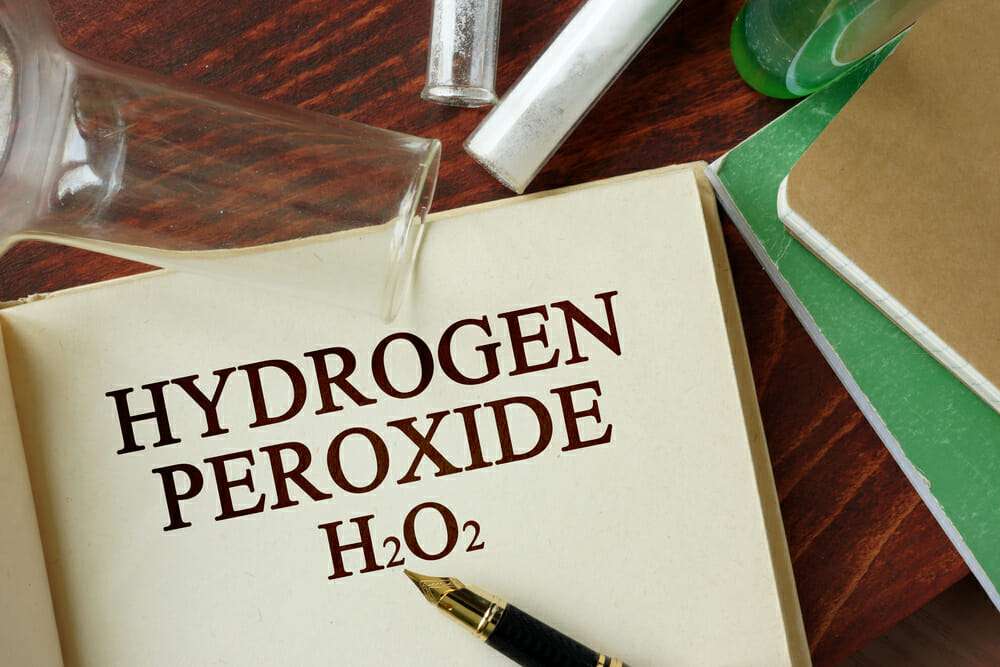 A notebook with the word hydrogen peroxide on it, useful for controlling fungus gnats.