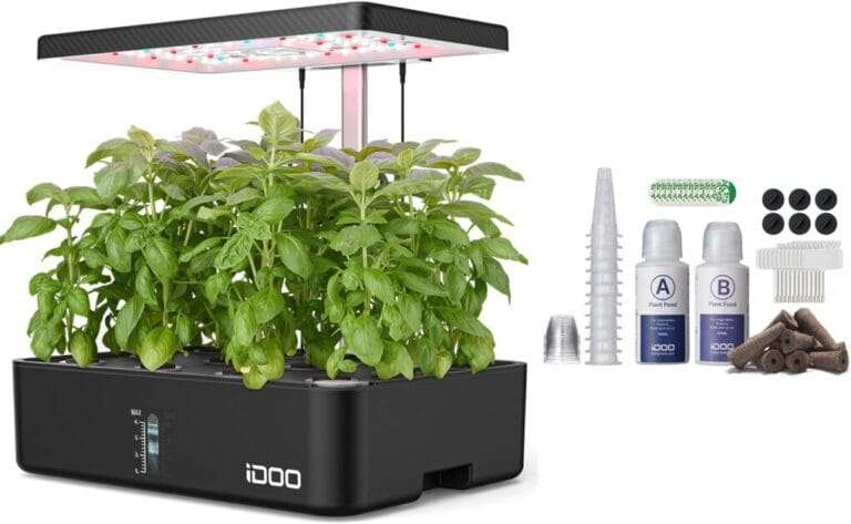 A black led grow box with plants and other items.